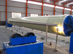 A curing station is in operation to solidity a FRP pipe.