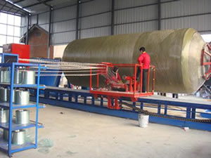 A horizontal FRP tank winding machine is winding a FRP tank with diameter less than 4000mm in the workshop.