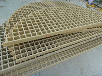There are two yellow semicircular FRP gratings that stack together, they have different sizes.